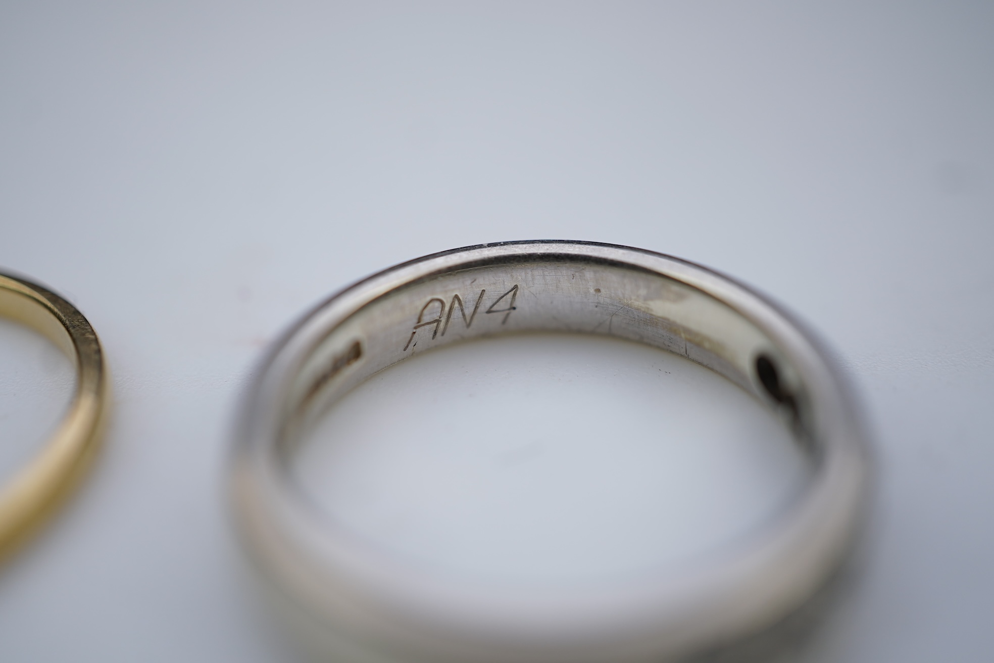 A diamond ring and two gold wedding rings